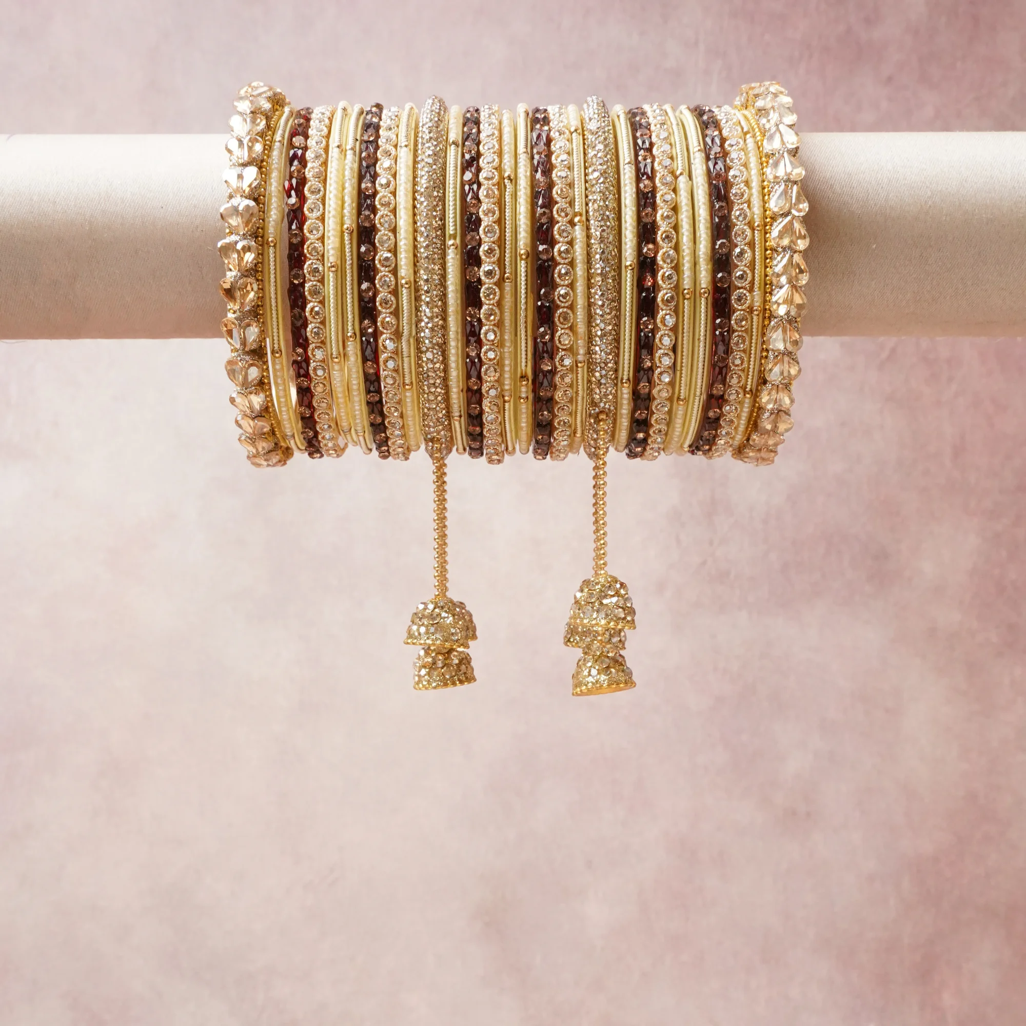A commanding Gold anchors this beautiful set, enriched with accents of Champagne, Ivory, Burgundy that add depth and dimension.

Featuring a striking composition of Kundan, glass beads, gold-toned metal, this set carries intricate craftsmanship and strong presence. Grand in form, it is created for moments that deserve to be marked.